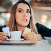 Worried Woman Having Teeth Coloration problems from Coffee